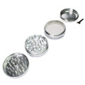Silver metal herb grinder with scraper tool and easy to use grips.