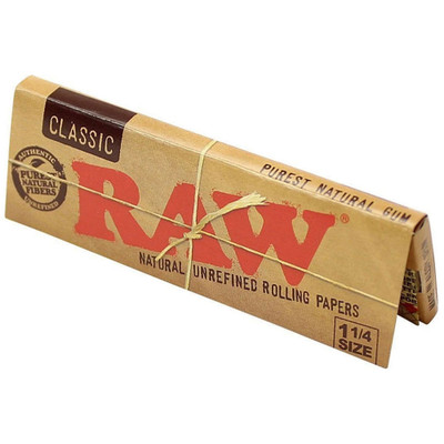 A single pack of Raw Classic 1 1/4 Rolling Papers standing upright.