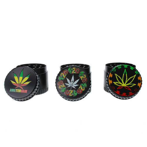Assorted black grinders with pot leaf in rasta colors on an all black metal body.