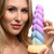 Woman holding a Mystique dildo.