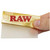 RAW Ethereal 1 1/4 rolling papers held between fingers to show how thin it is.