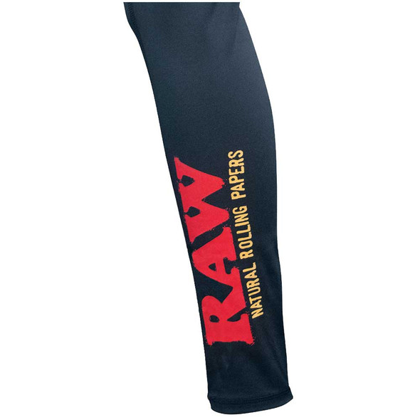 Side view of the RAW logo printed on the lower leg of these yoga pants.