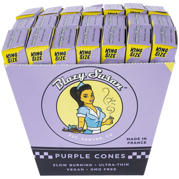 An open display box with 21 packages of Blazy Susan King Size Purple Cones.