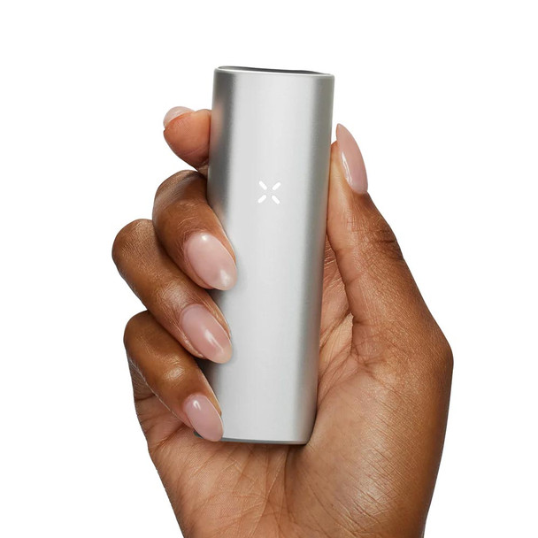 A Pax Mini Platinum being held in a hand against a white background.
