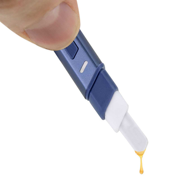 Hot Knife Storm in use, with a dab dripping off its tip. High end dab tool by Puffco.