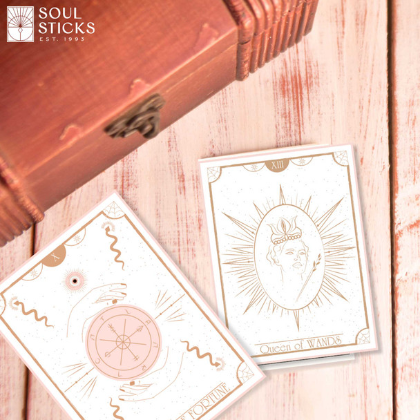 Close up of Elegant Essence tarot cards featuring minimalist line art and soft neutral design.