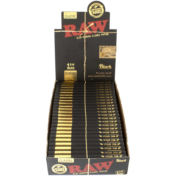 Opened display box containing 24 Raw Black 1 1/4 paper packs.