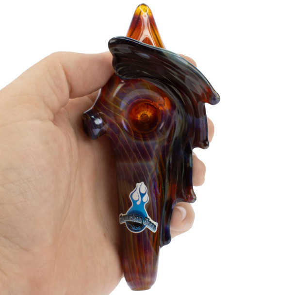 Chameleon Glass Conch Shell Pipe in hand for scale and portability.