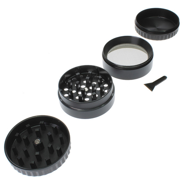 Black metal rasta leaf grinder apart.