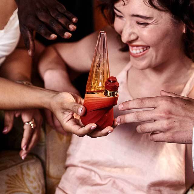 People at a party enjoying a Puffco Peak Pro Daybreak.