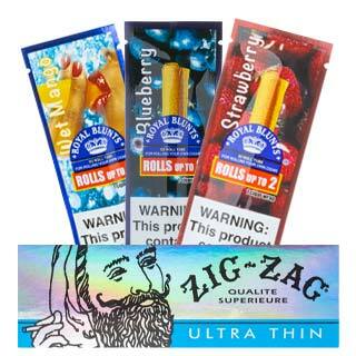 Royal Blunts wraps behind a pack of Zig-Zag smoking paper.