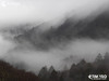 Fog settles among the mountains
