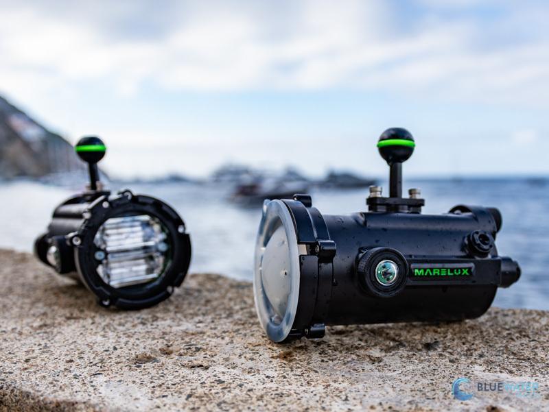 Two Marelux Apollo S underwater strobes with ball mounts placed on a poolside deck