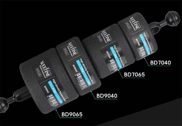 Underwater photographer using float blocks on tray