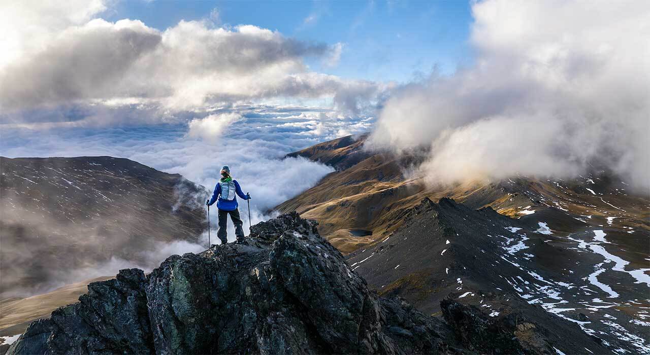 Garmin inReach Mini 2 compact adventure communicator on a rugged trail