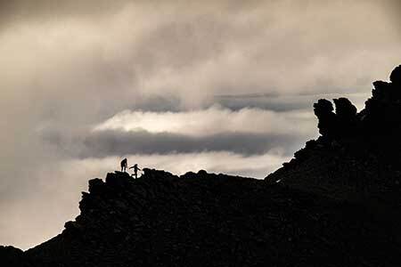 Garmin inReach Mini 2 clipped to a harness in wet conditions