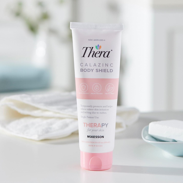 Thera Calazinc Body Shield skin protectant cream displayed in a bright bathroom setting