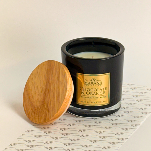 Makana Confections Chocolate & Orange hand poured soy candles in a black glass jar and wooden lid
