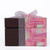 A gift box is decorated with an elegant ribbon and labeled with two types of chocolates: Mango Truffles and Macadamia Butter Toffee Crunch.

The picture showcases a sophisticated, dark brown box that exudes a sense of luxury and delicacy. The box is adorned with a light pink, sheer ribbon tied in a neat bow at the top, adding a festive touch. On the front of the box, two colorful labels are prominently displayed. The top label features the words "Mango Truffles" against a vibrant, swirling background of pink and green patterns. Below that, another label reads "Macadamia Butter Toffee Crunch," set against a similarly decorative background. The overall atmosphere of the image is one of indulgence and celebration, suggesting that the chocolates inside are special treats meant for gifting or personal enjoyment. The clean, white backdrop enhances the focus on the beautifully presented box, evoking feelings of anticipation and delight.