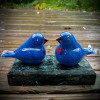 Pastel blue glass Lovebirds, glass birds, glass bird sculpture by Glass artisan Chris Sherwin at sherwin art glass studio, glassblowing, studio deck overlooking the Connecticut River after rain....Bellows Falls, Vermont