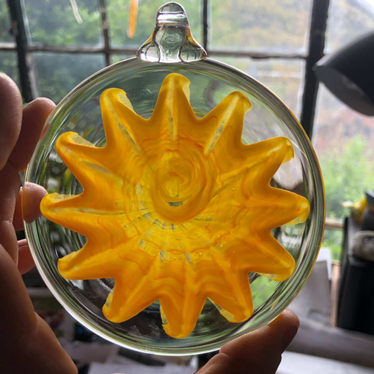 Glass Sun Suncatcher mandala, glass sun disc ornament, glass hanging  disc, made by Chris Sherwin in his Vermont glassblowing studio.