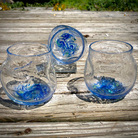 handblown Crackle Thumblers are hand-sculpted, no mold. Crackle appearance/texture and thumb/finger depressions for a "no slip grip"!  These fun to hold, and drink from glasses are approximately 3 X 3 inches. Shown here in "Summer Seas"  handblown Crackle Thumblers are hand-sculpted, no mold. Crackle appearance/texture and thumb/finger depressions for a "no slip grip"!  These fun to hold, and drink from glasses are approximately 3 X 3 inches. Shown here in "Summer Seas"