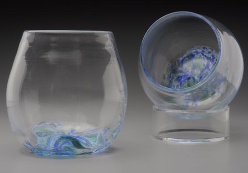 Set of 2 hand blown Stemless "not just for" Wine Glasses. hand-sculpted and freeblown, no mold. Each approximately 3 X 3 inches.  These fun to hold, and drink from, Everyday drinking glasses are approximately 3 X 3  1/4 inches. Shown here in Summer  Seas -- a blend of blues , with hints of teal and green, to whisk you off to your at the water destination!

"Everything tastes better in a Sherwin Art Glass"!
Please contact me with any questions.