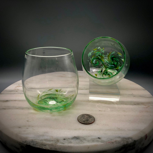 Set of 2 hand blown Stemless "not just for" Wine Glasses. hand-sculpted and freeblown, no mold. Each approximately 3 X 3 inches.  These fun to hold, and drink from, Everyday drinking glasses are approximately 3 X 3  1/4 inches. Shown here in Irish Spring -- " A taste of the old country!"
Please contact me with any questions.