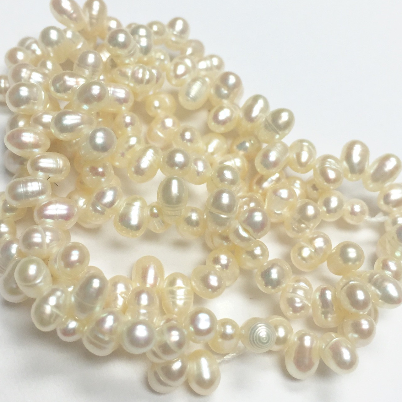 Sweet Ivory Top Drilled Dancing Freshwater Pearls 2.5-3mm - A Grain of Sand
