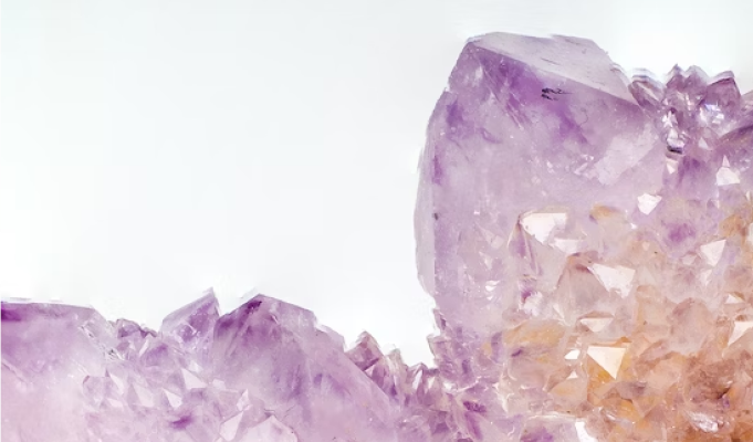 Purple tinted crystals on white background