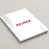 RE/MAX White Dawn hardcover presentation cover – front angled view, white soft-touch finish with modern RE/MAX logo