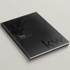 Keller Williams 'Black Marble' hardcover presentation cover – front angled view, white soft-touch finish with modern KW logo