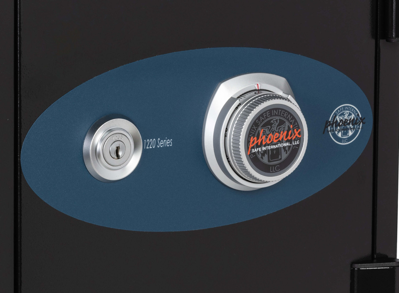 Close-up of lock panel on the black Phoenix Dual-Lock Fireproof Safe, showcasing key and combination lock, 1220 Series branding.