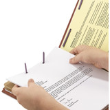 Hands placing papers onto fasteners inside a red pressboard classification folder