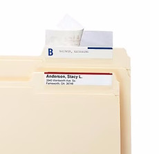 File folder with a 2-inch by 3.5-inch Mylar label protector securely covering a business card-sized label, demonstrating the protector’s clear and durable shielding of the label on the folder tab.