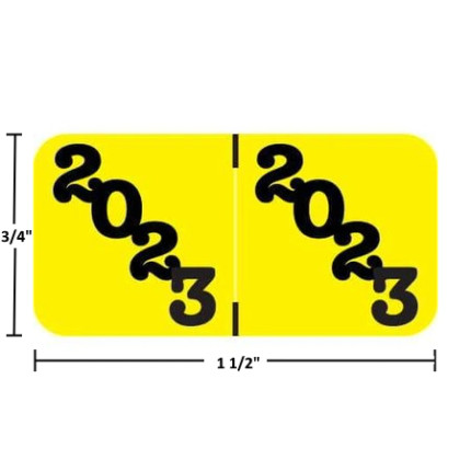 Yellow POS POYM-23 wraparound year label with bold black “2023” printed diagonally on both halves. Overall size 3/4 inch high by 1-1/2 inches wide; center guide indicates the fold for end- or top-tab folders. Polylaminate withstands smearing, moisture, and edge abrasion.