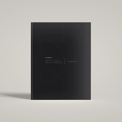 Front view of Realty ONE Group black hardcover presentation cover with branded typography.