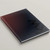 Angled view of Keller Williams Ombre Red lay-flat hardcover presentation cover with soft-touch matte finish