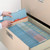 Blue top tab file folders arranged in a drawer filing system with alphabetical labels and an out guide visible.