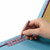 Hand securing SafeSHIELD fastener inside a blue pressboard classification folder