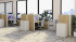 Multiple FireShield Edge Series fire-rated storage cabinets in a light, open office with cubicles, desks, and large windows.