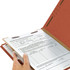 Red legal-size classification folder holding fastened documents, showing interior divider and K-style fasteners