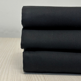 Stack of Plain Black Tea Towels by Good Linen Co