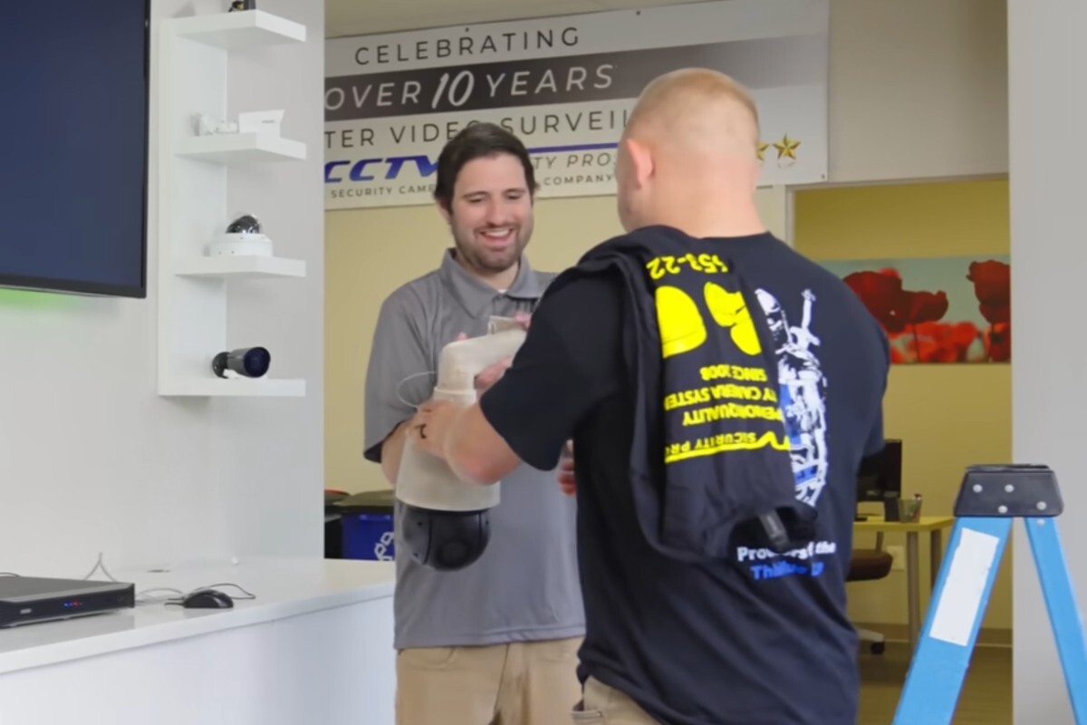 CCTV Security Pros surveillance expert helping a customer choose professional camera equipment