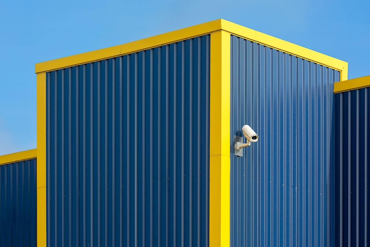 security camera on a metal decking wall