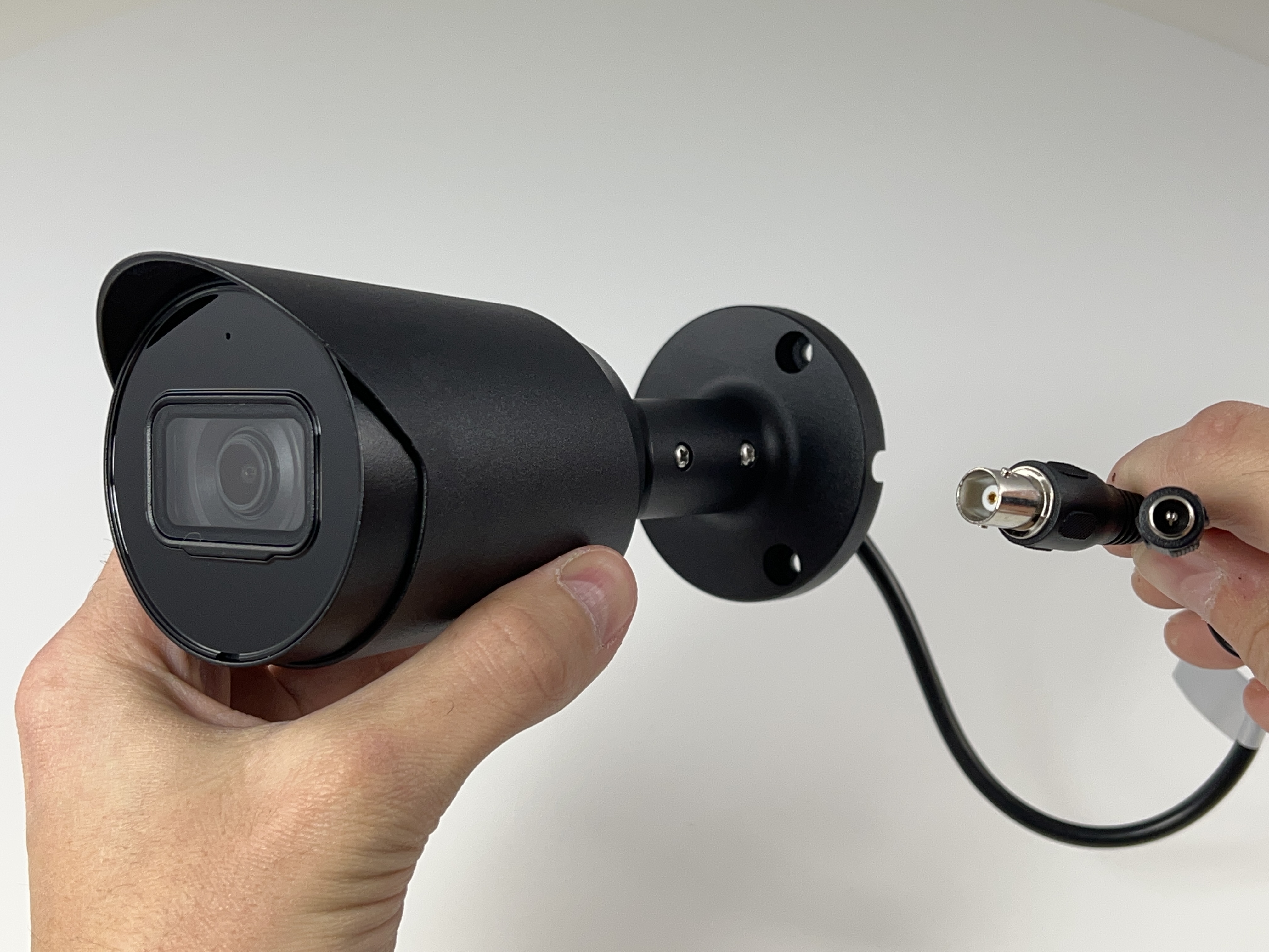 Person Plugging in Bullet Camera