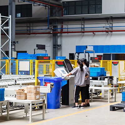 two employees working in factory