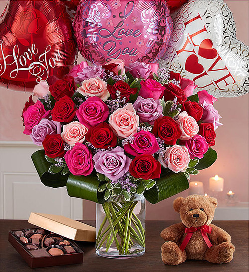 Let her know your love is forever with a sensational surprise she’ll remember forever! We’ve hand-arranged 50 timeless roses in striking shades of red, pink and lavender inside a stylish cylinder vase for the ultimate romantic gesture. And because one amazing gift deserves another (and another…and another!), pair these gorgeous blooms with our huggable plush bear, decadent chocolates and “I Love You” balloons!
Let her know your love is forever with a sensational surprise she’ll remember forever! We’ve hand-arranged 50 timeless roses in striking shades of red, pink and lavender inside a stylish cylinder vase for the ultimate romantic gesture. And because one amazing gift deserves another (and another…and another!), pair these gorgeous blooms with our huggable plush bear, decadent chocolates and “I Love You” balloons!