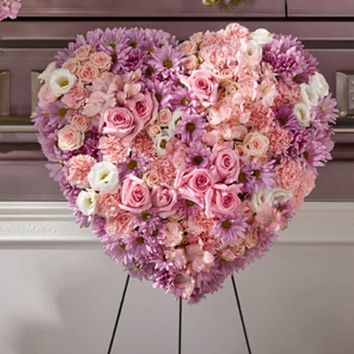 . Each carnation, rose and daisy pompon complements your heartfelt messages of sympathy. This standing spray is perfectly fit to honor your most loving friend or family member who has passed. - Details: o Heart is approximately 22""H x 22""W"