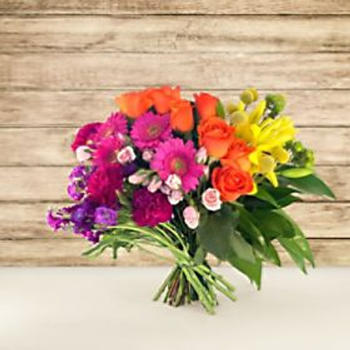 Express appreciation to everyone in your life by sending the You Color My World Bouquet. Designed in collaboration with Carrie Colbert, whose lifestyle brand slogan is "More Color, Please!", the You Color My World Bouquet is sure to brighten any recipients day with its bold rainbow hues. Believing in the power of color to spark joy, Carrie created this bouquet specifically for times such as this. Who among us couldn't use a special dose of rainbow and sunshine floral goodness? You'll certainly make a statement when you send this eye-catching bouquet. What are you waiting for? Don't be a shrinking violet- live out loud when you send this modern marvel!
